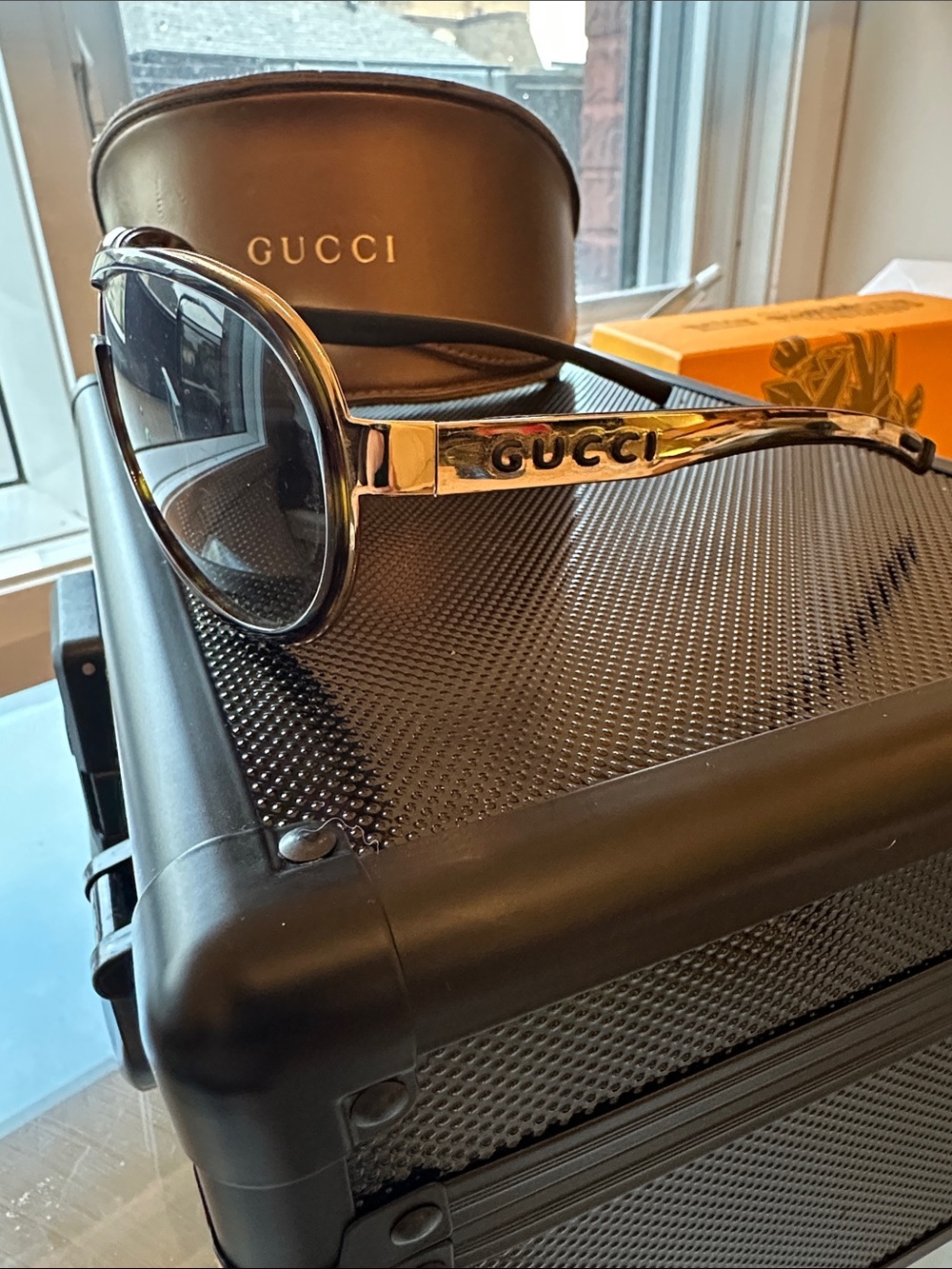 Gucci Silver Frame Sunglasses with Black Lenses and Turtle Shell Boarders